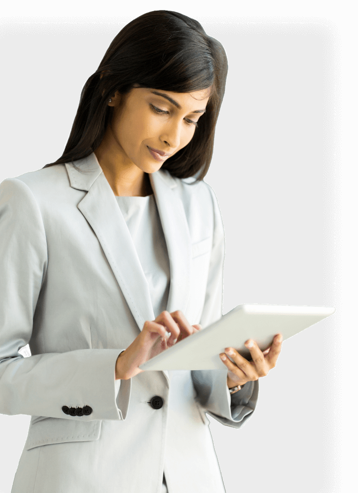a woman in a white suit is using a tablet